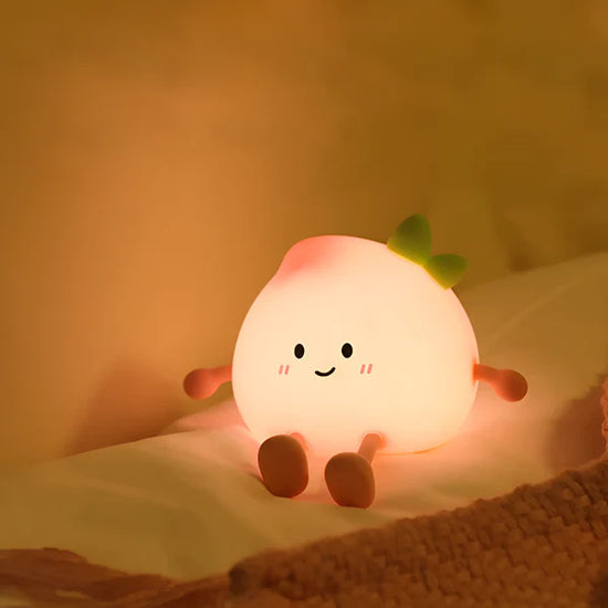 Lumini® Squishy Peach LED Night Light.