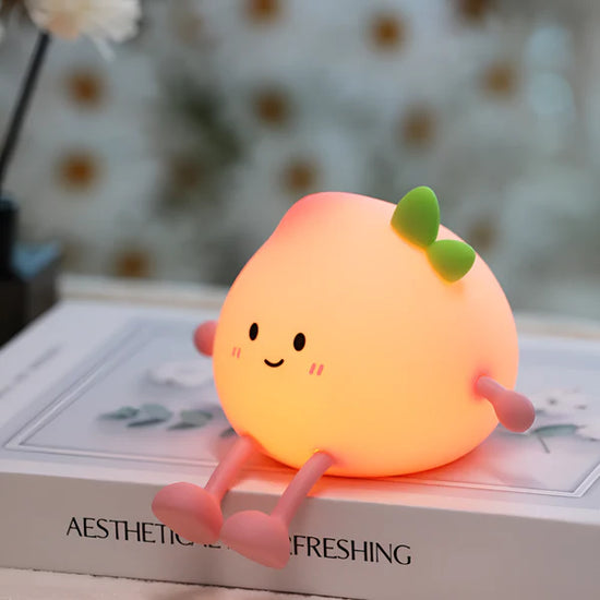 Lumini® Squishy Peach LED Night Light.