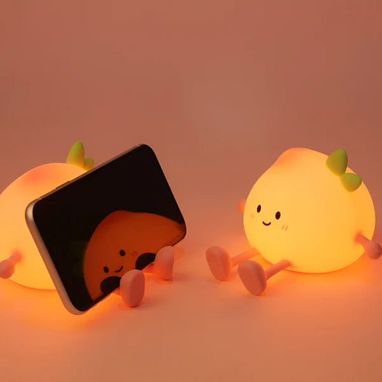 Lumini® Squishy Peach LED Night Light.