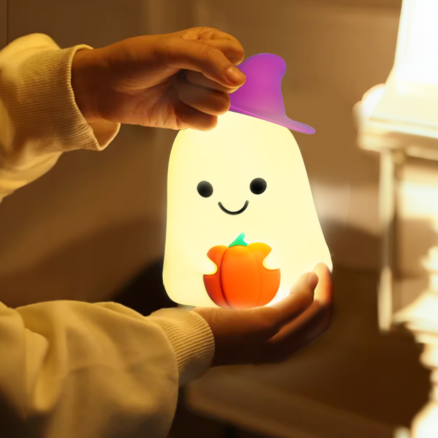 Lumini® Squishy Ghost Holding a Pumpkin LED Night Light.